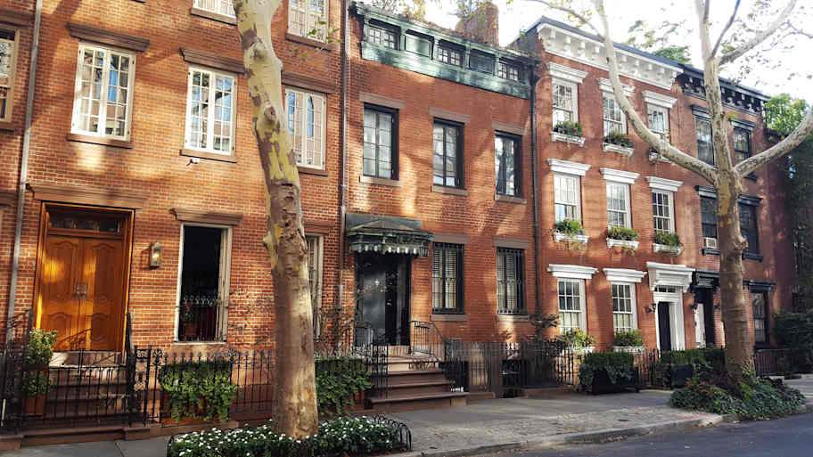 Street in New York City with elegant brick townhouses