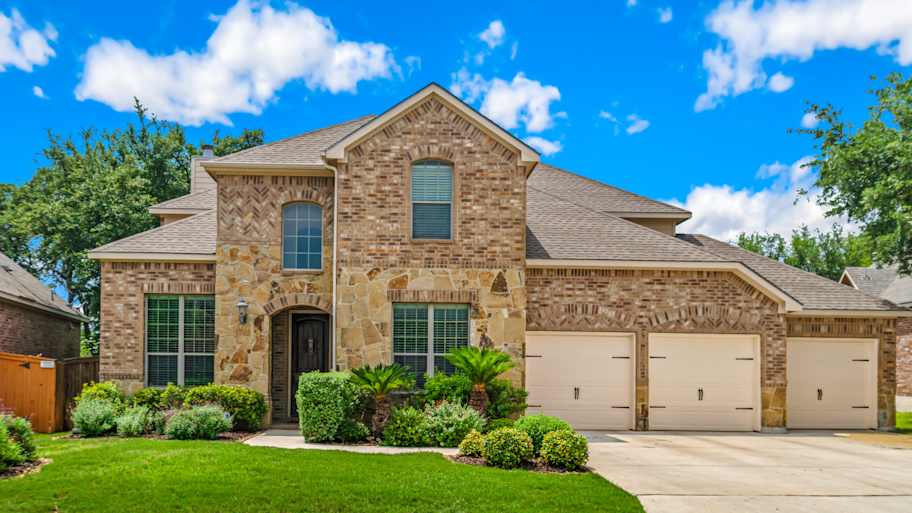 large brick house with large windows