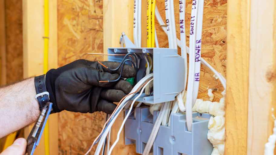 Electrician wiring a new home