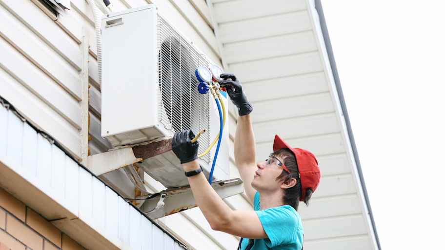 Young man working on an AC unit