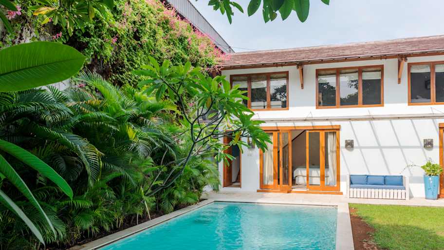 A beautiful pool in the backyard of a house