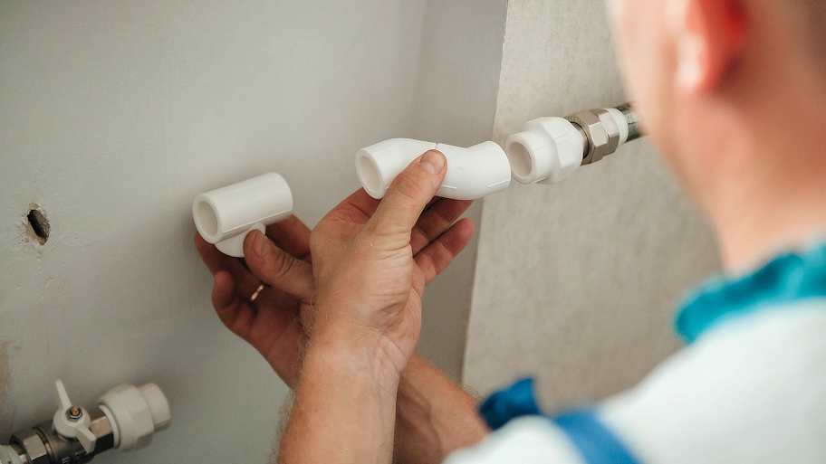 Plumber working on a brand new radiator