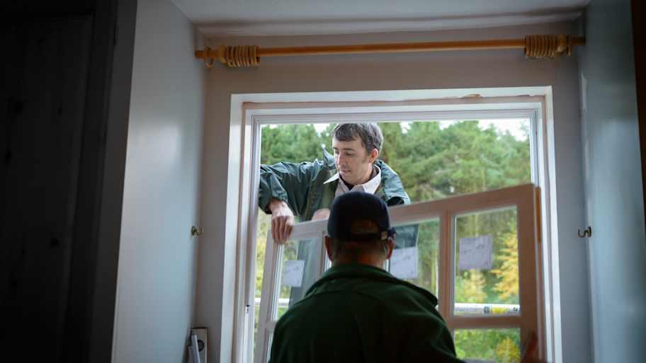 Workers installing new window 