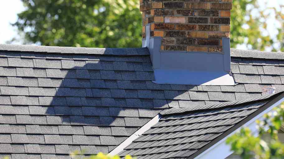 Roof with chimney and flashing