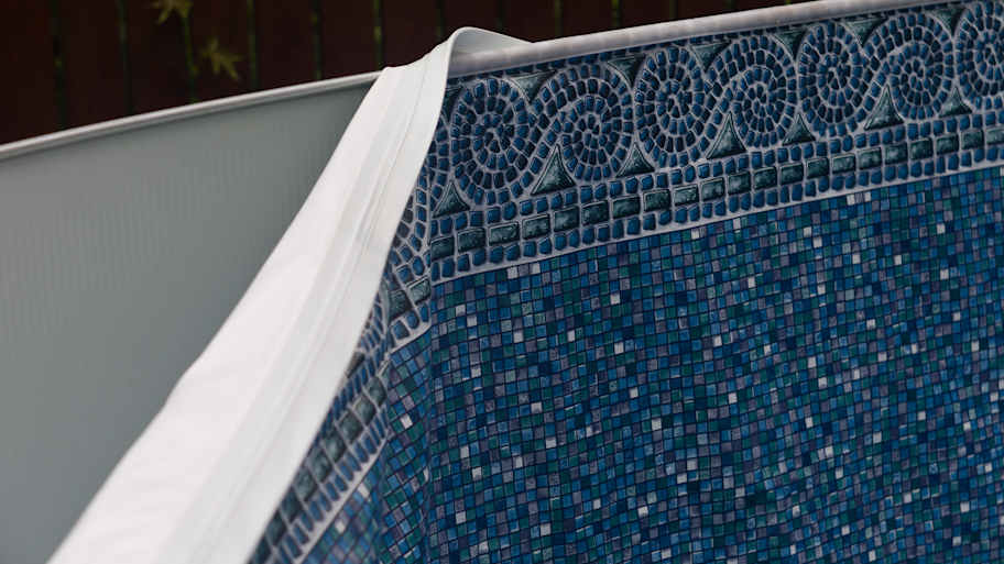 A pvc pool liner being installed