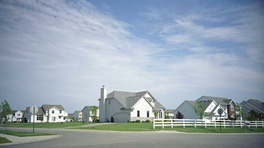 Typical houses with white picket fences 