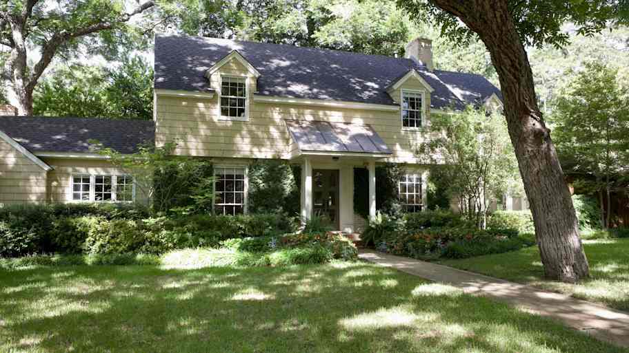The exterior of a beautiful house with lawn