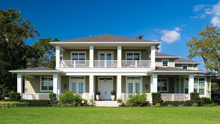 large tampa home with shingle roof   