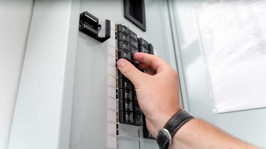 Testing new circuit breakers installed in an electrical box