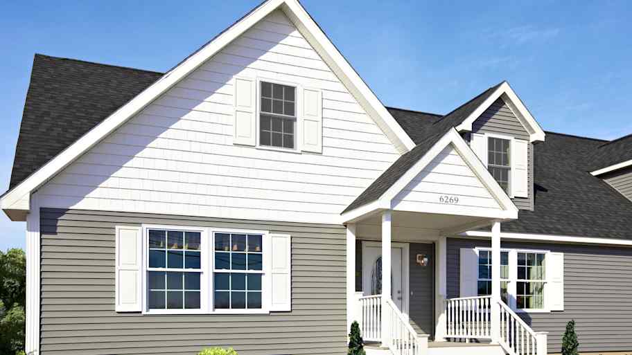 House with gray and white fiber cement siding and window shutters  
