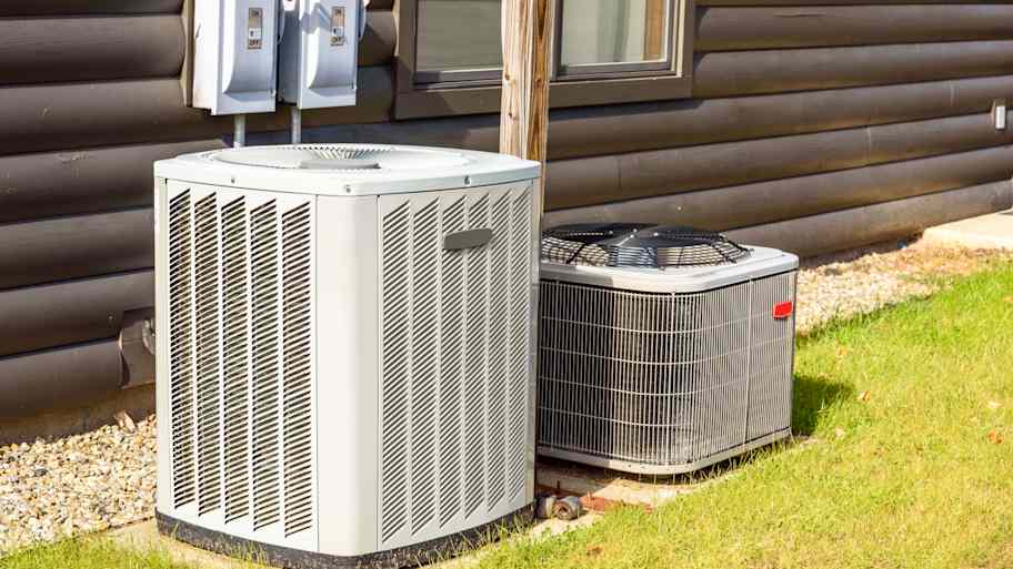 An HVAC unit in a backyard 