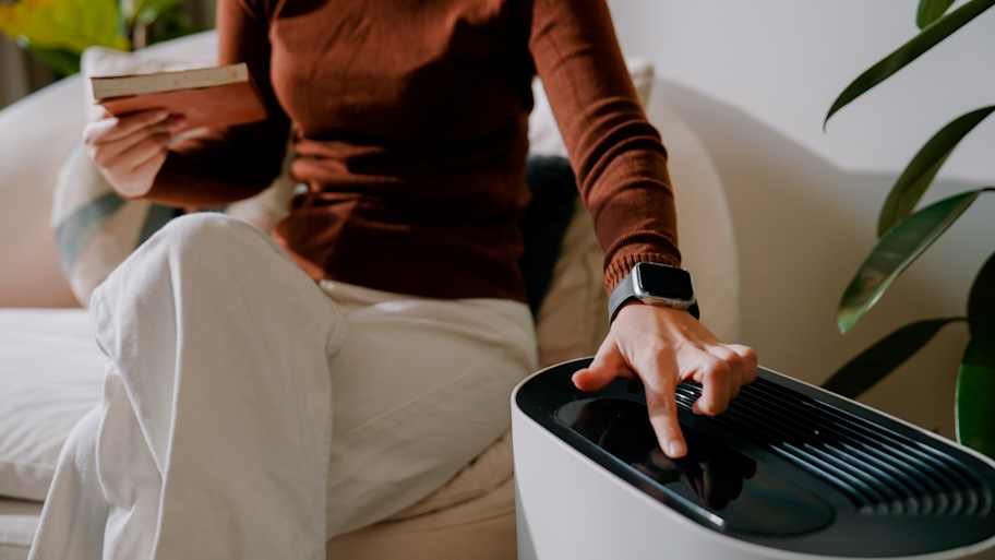 A woman operating a portable AC 