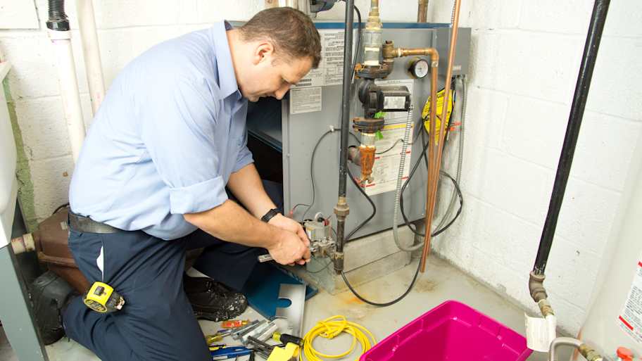 technician installing furnace
