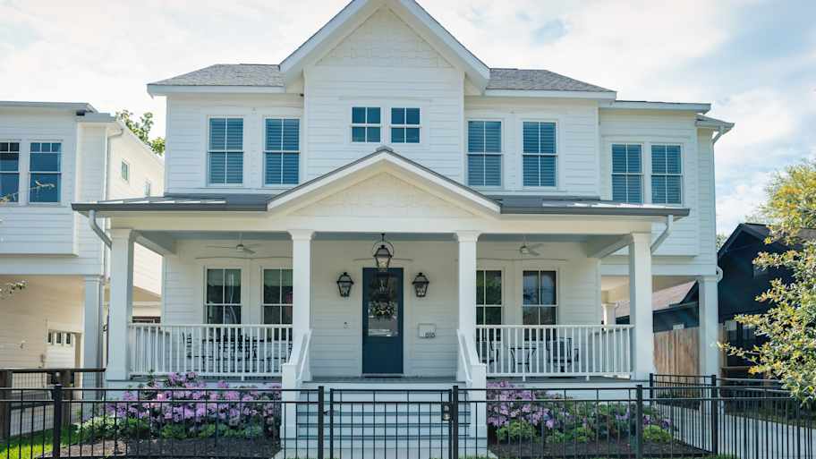 white house with shingle roof in houston