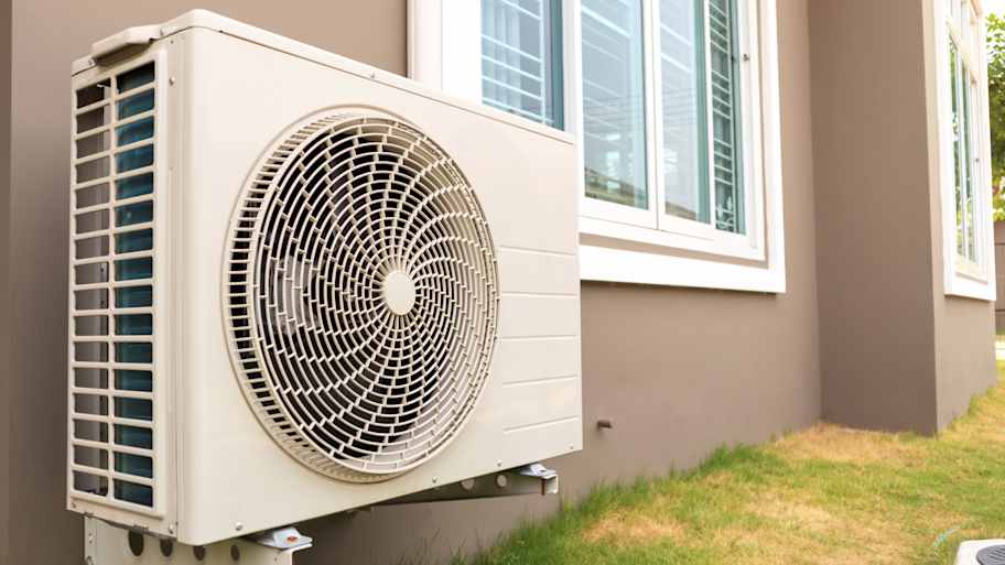 Air conditioner unit mounted on an exterior wall  