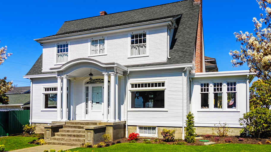 Vinyl siding installed on a colonial-style house   