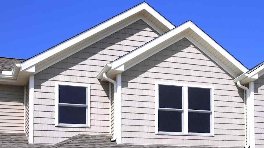 Vinyl shake siding installed on a two-story house  