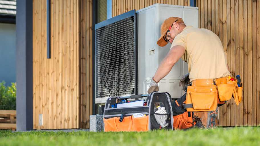 Worker fixing heat pump
