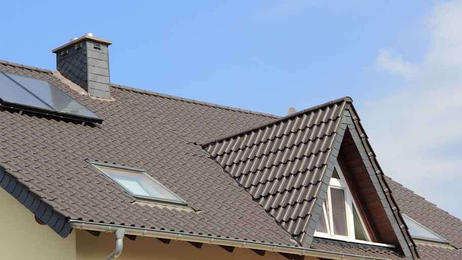 Dormer window and skylights on a metal roof