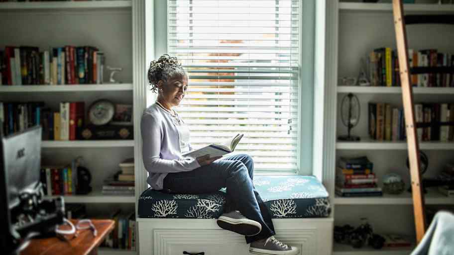 Woman reading in home library