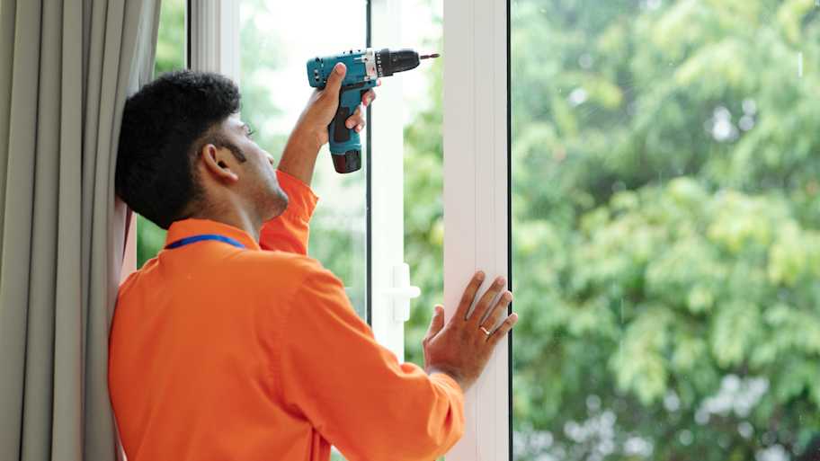 technician installing new windows