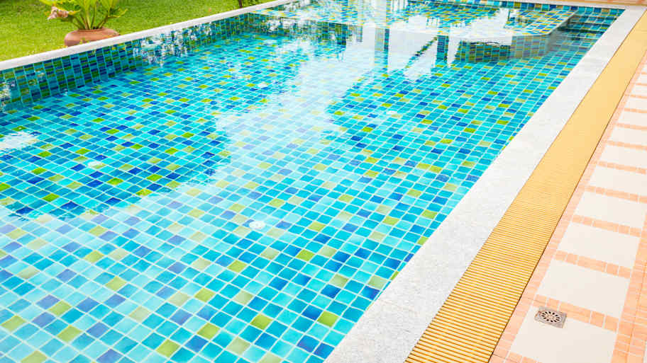 Rectangular backyard swimming pool with tile liner  