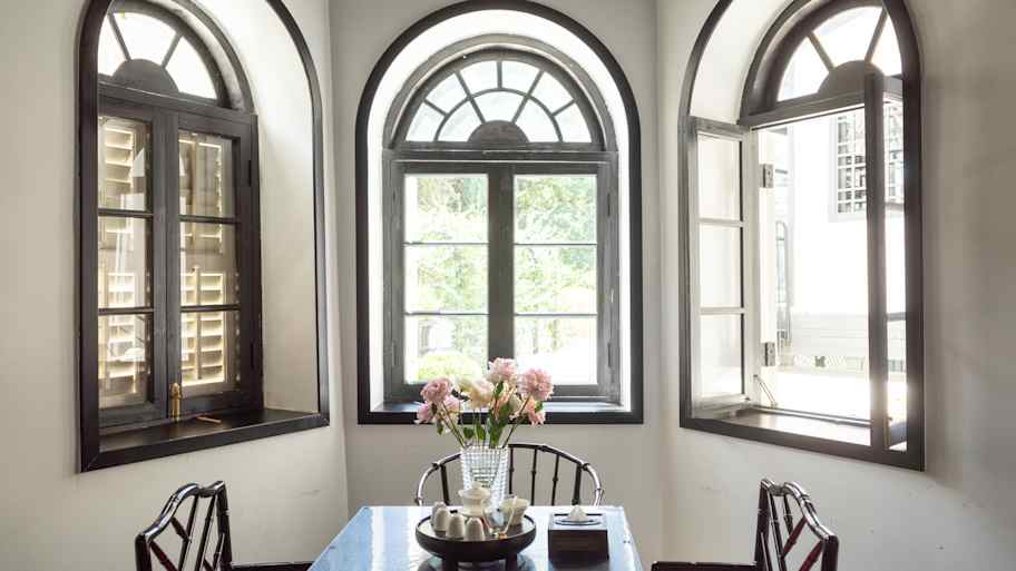 The interior of a room with arched windows 