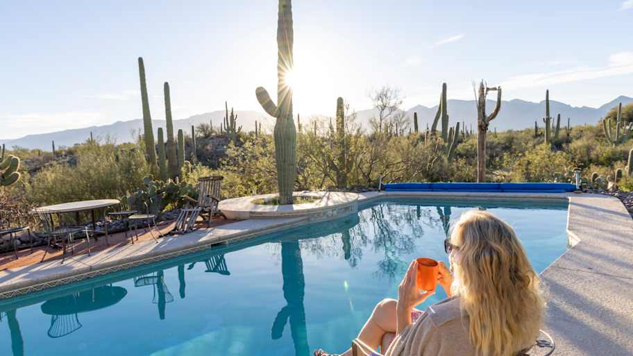 Woman sitting by pool in Phoenix 