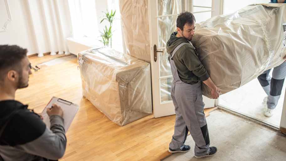 Movers carrying furniture