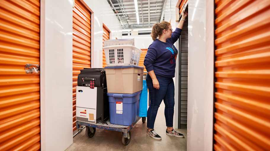 woman opening door to storage unit