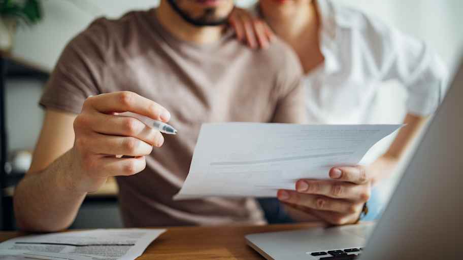 Couple paying bills at home