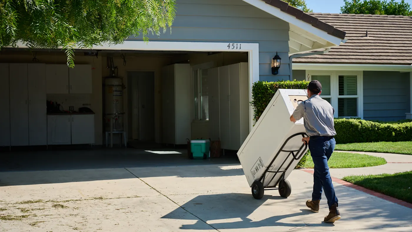 Man moving an appliance