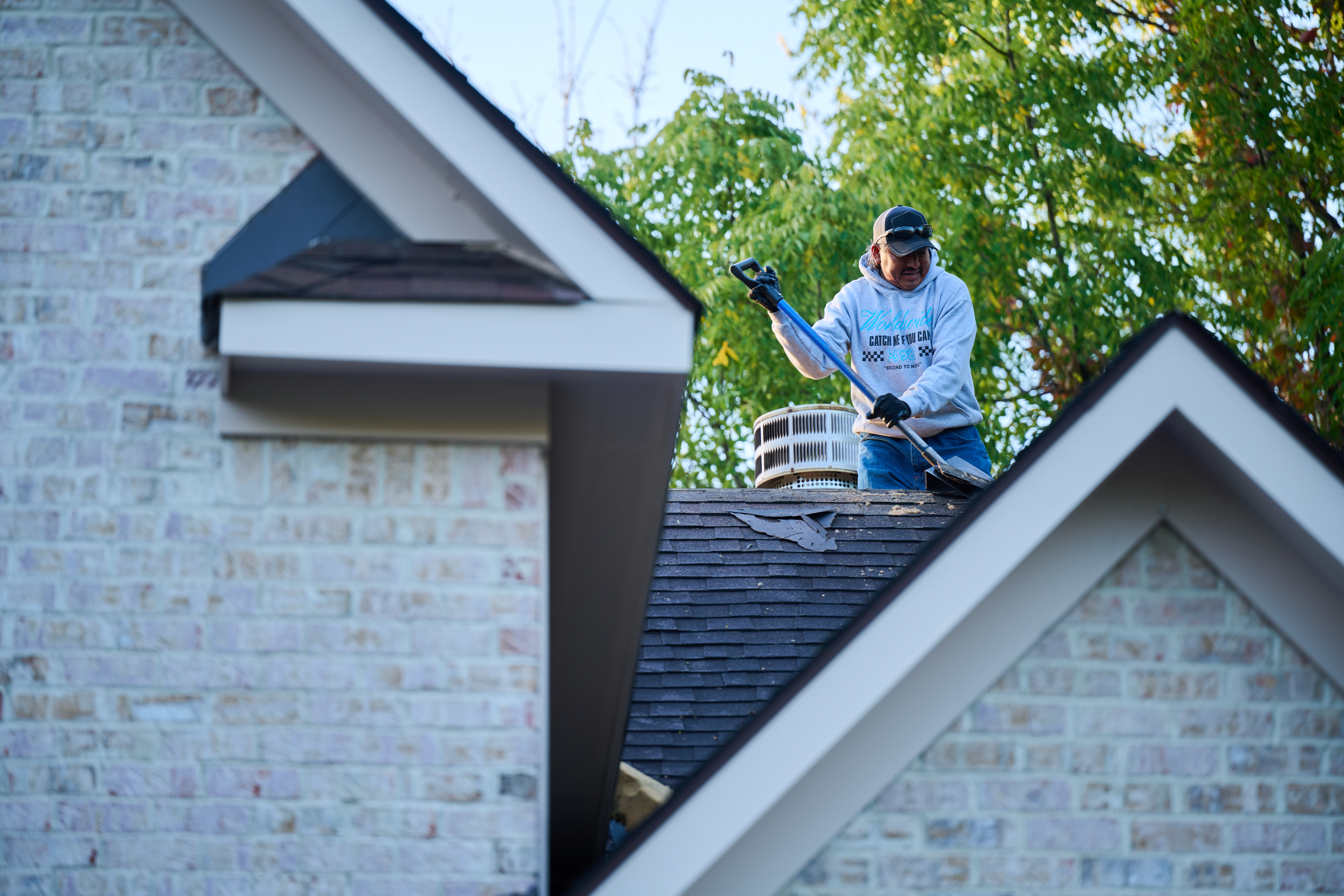 Man working on roof.
