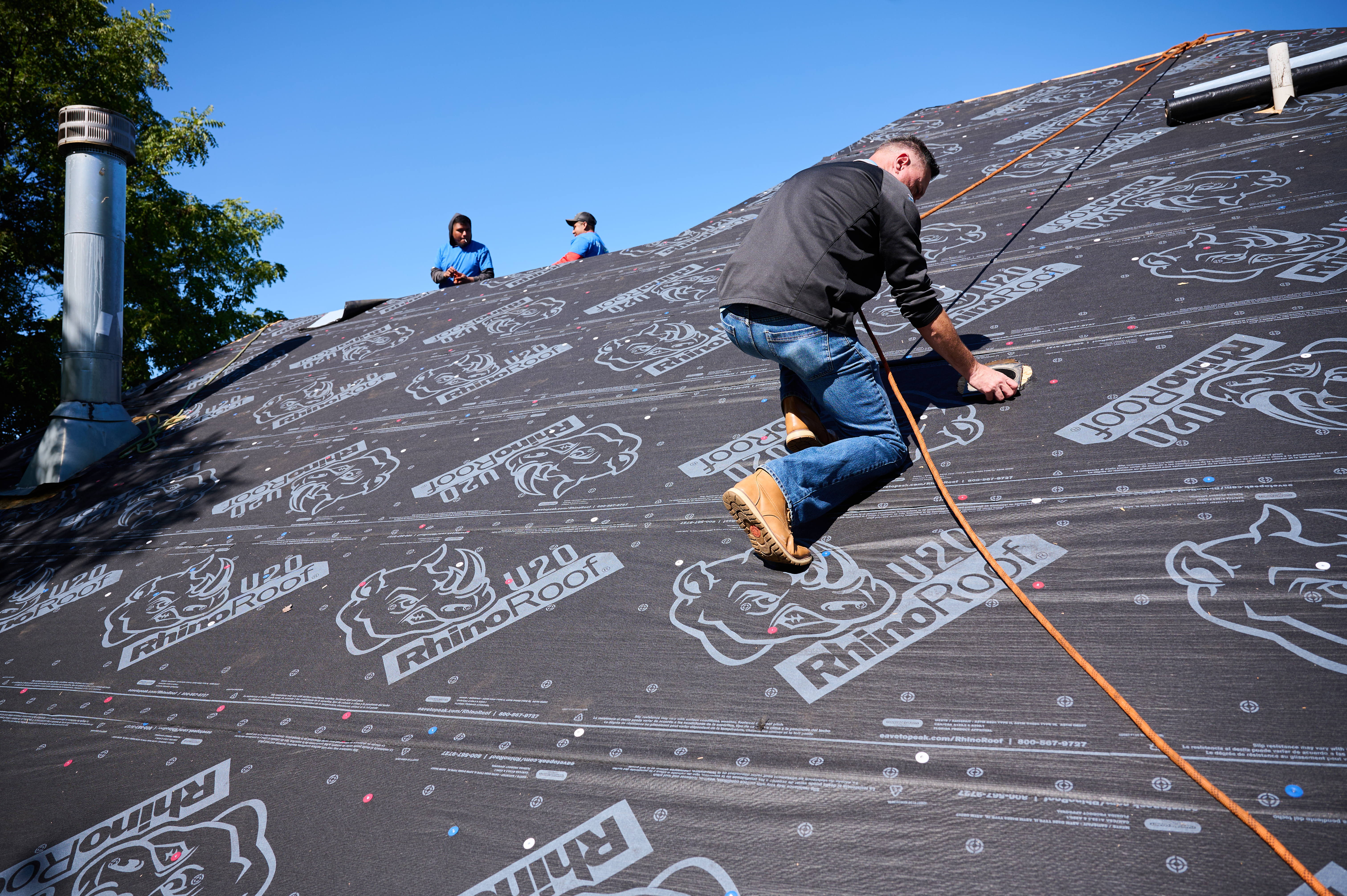 Men prepping roof for singles. 
