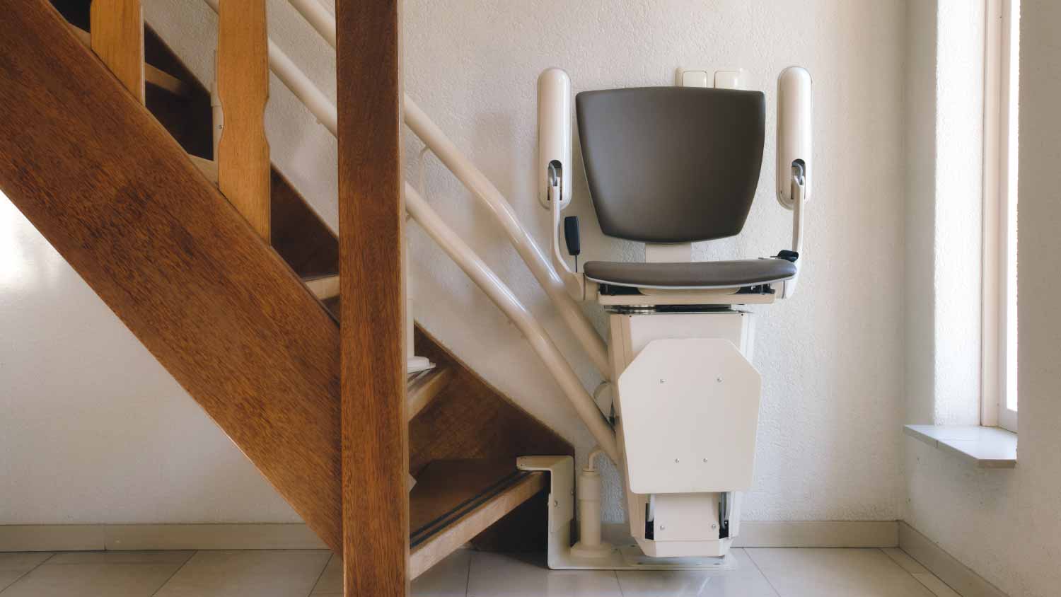 Automatic stair lift on staircase