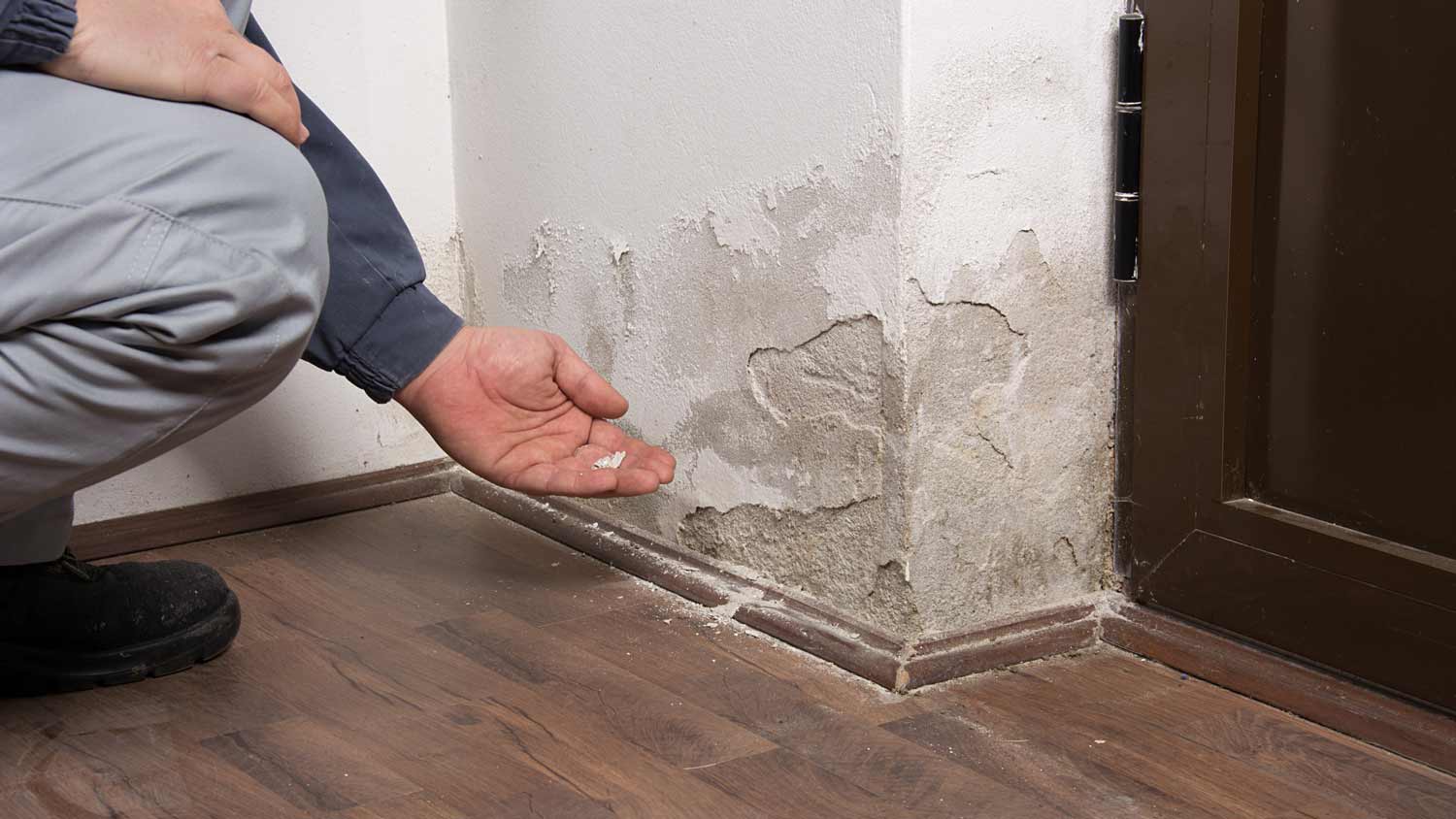 pieces of wall falling off due to water damage