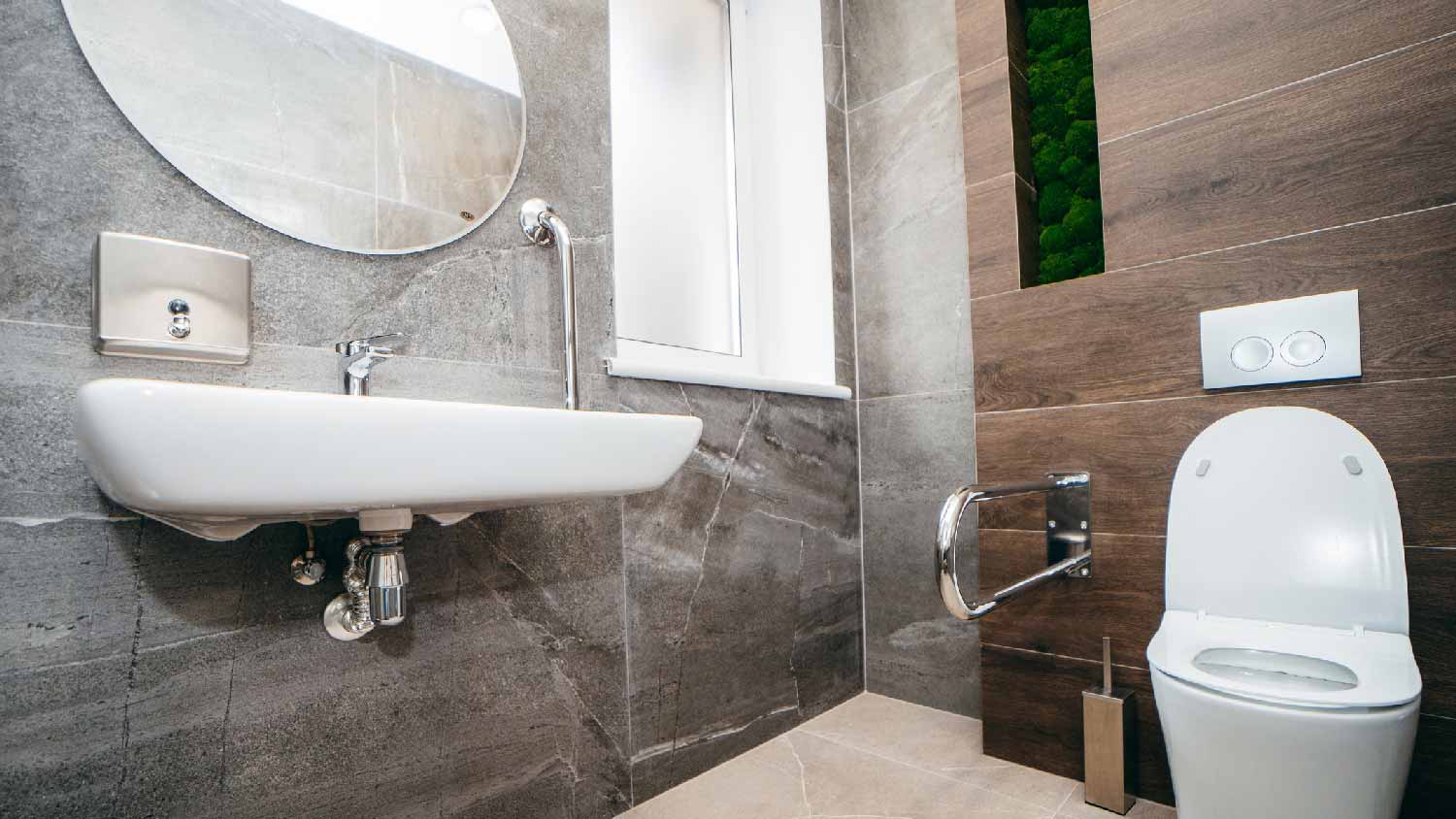 An accessible bathroom with a toilet grab bar