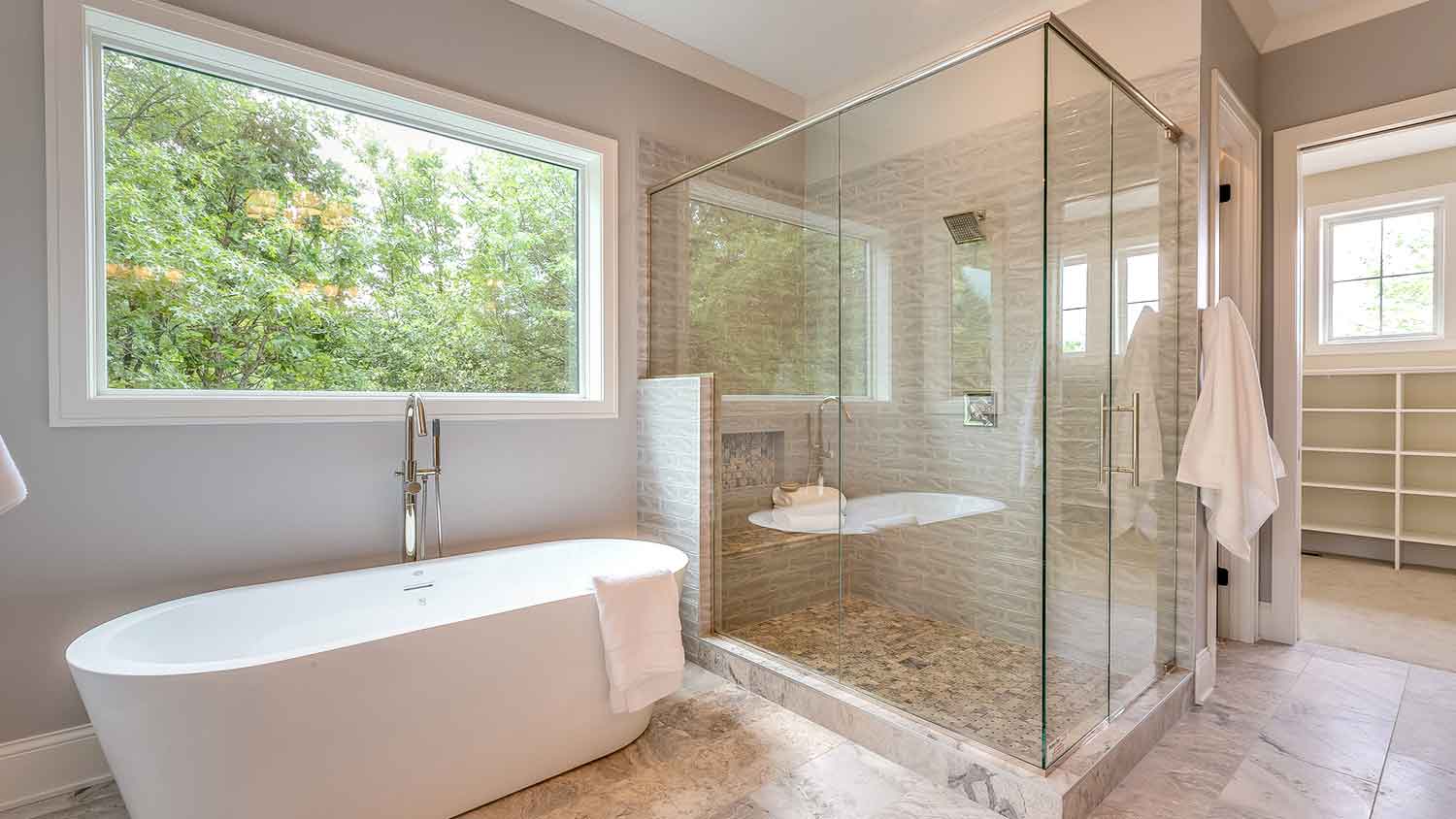 Large bathroom with glass shower door