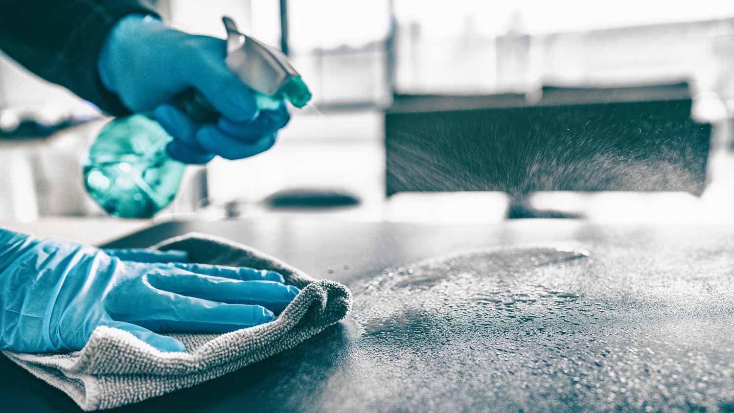 Man cleaning home table