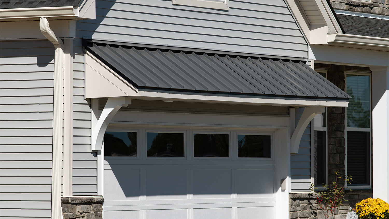 Grey awning over garage