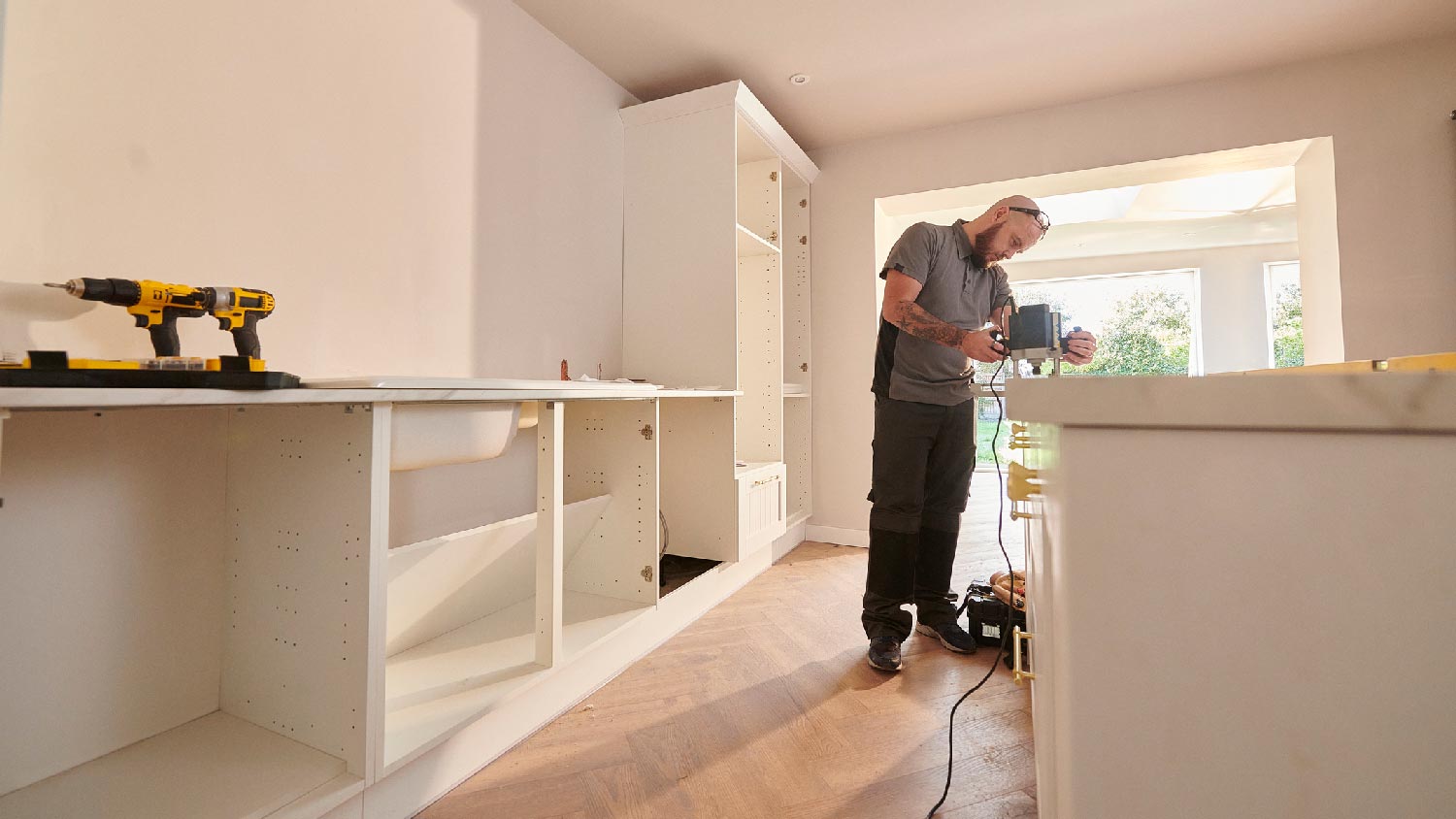 A professional installing a new solid surface countertop