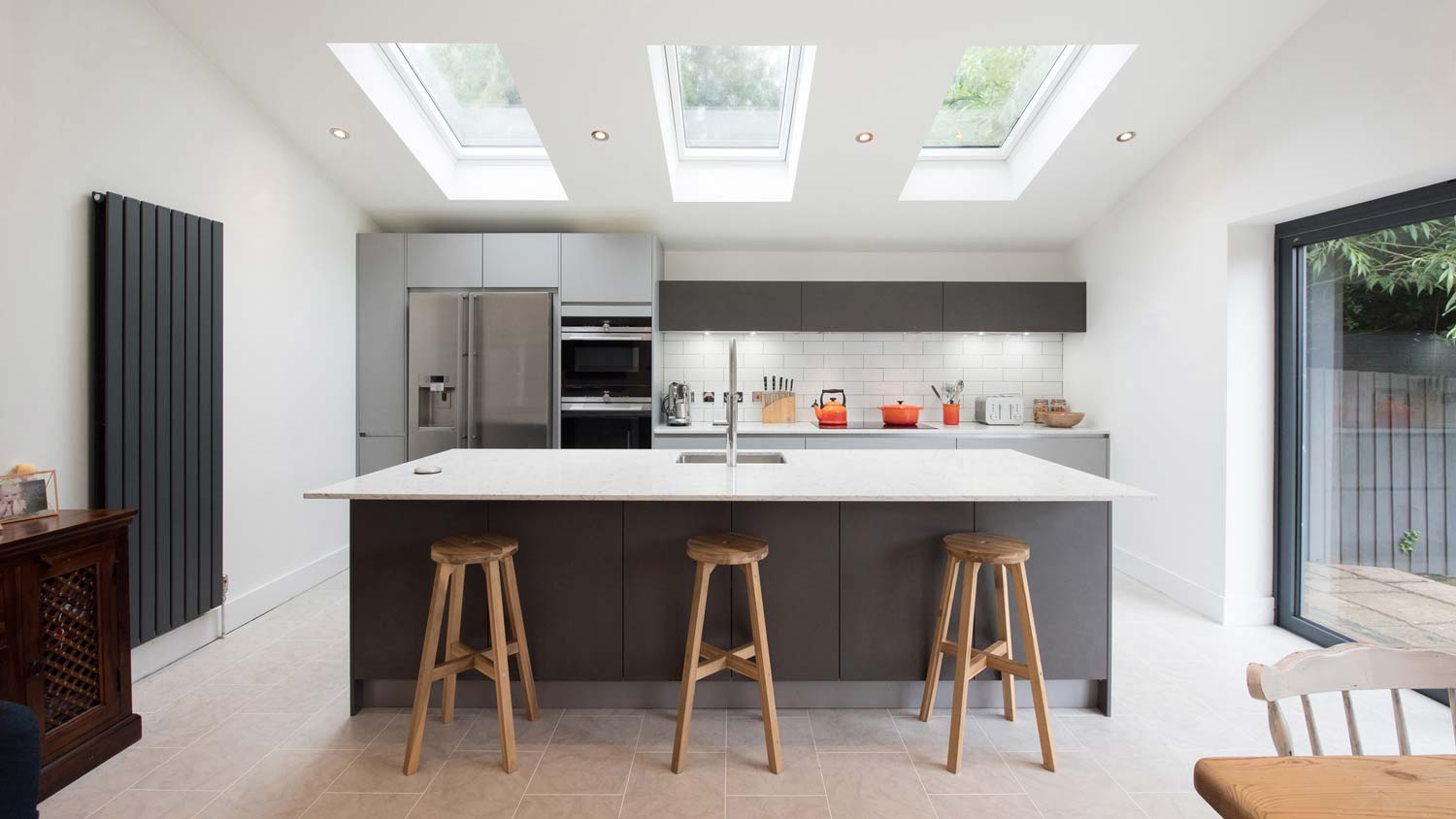 A modern kitchen with three skylights