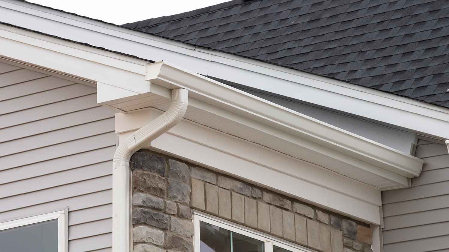 Aluminum rain gutter system installed on the house