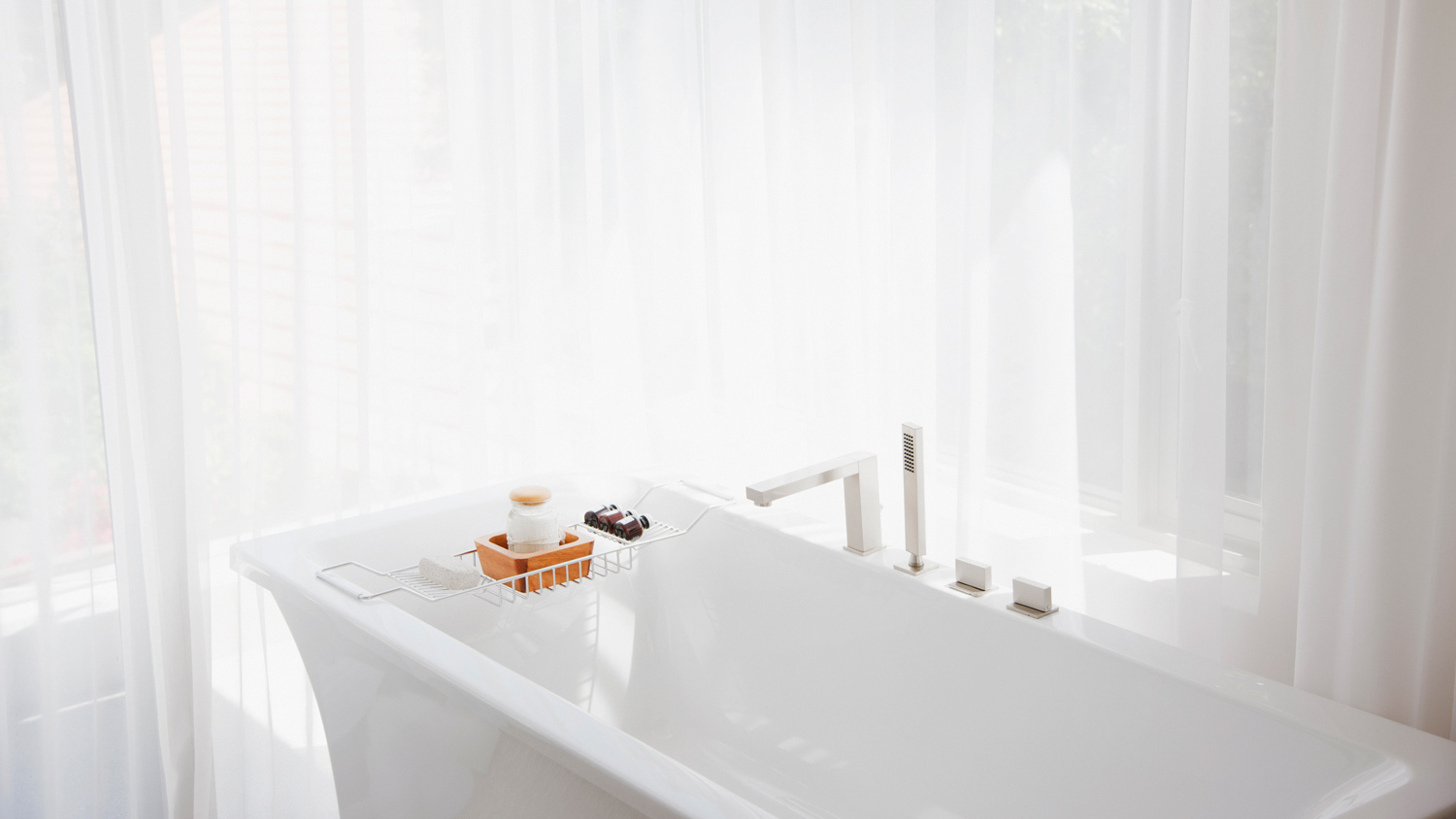 A modern bathtub in a bright bathroom