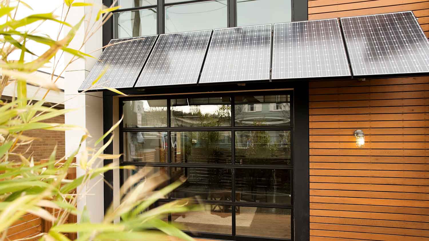 Patio awning with solar panels