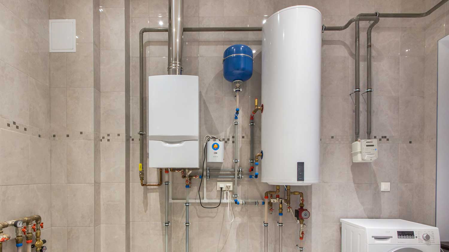 Gas and electric water heater in a boiler room