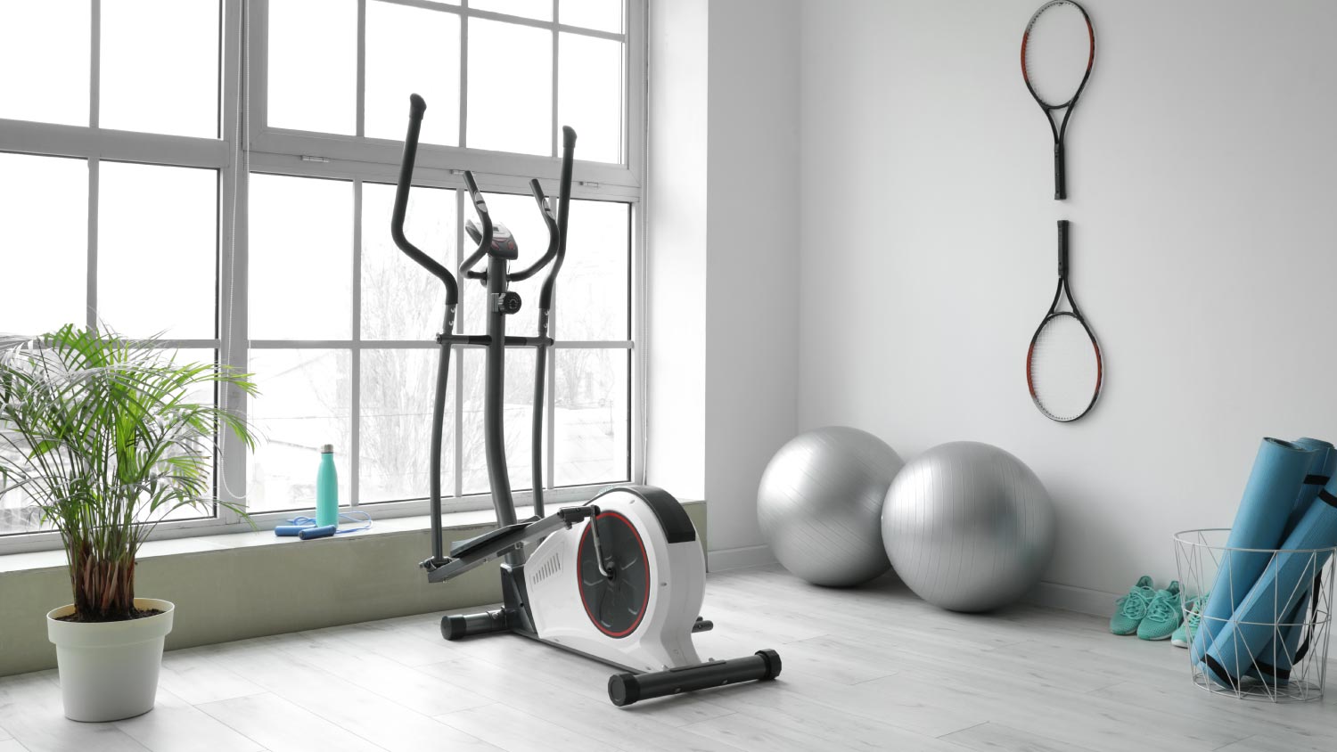 Sports equipment and fitness balls in gym at home