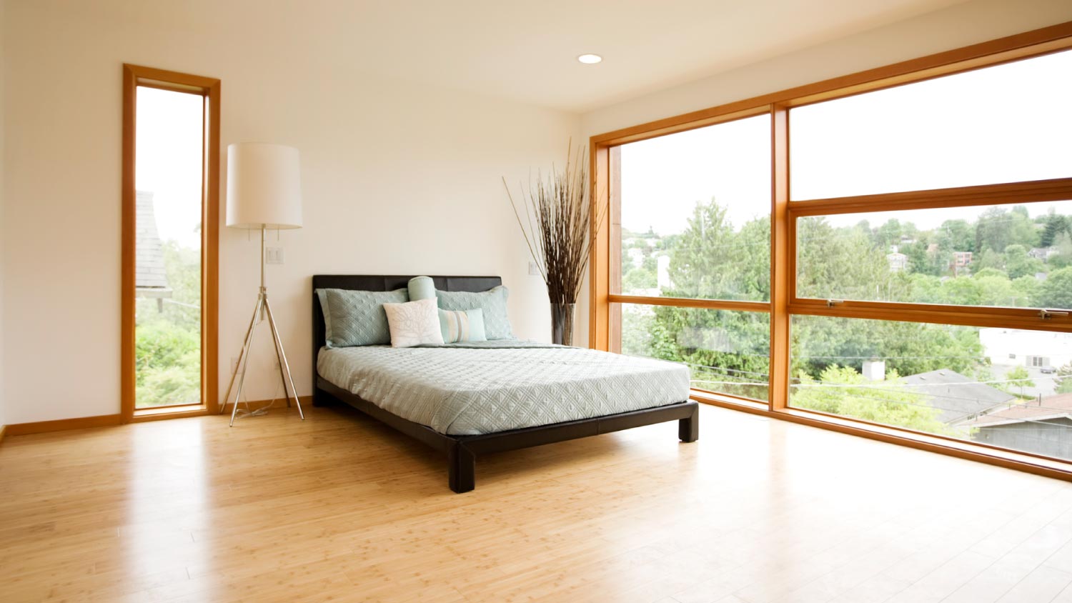 A modern bedroom with bamboo floors