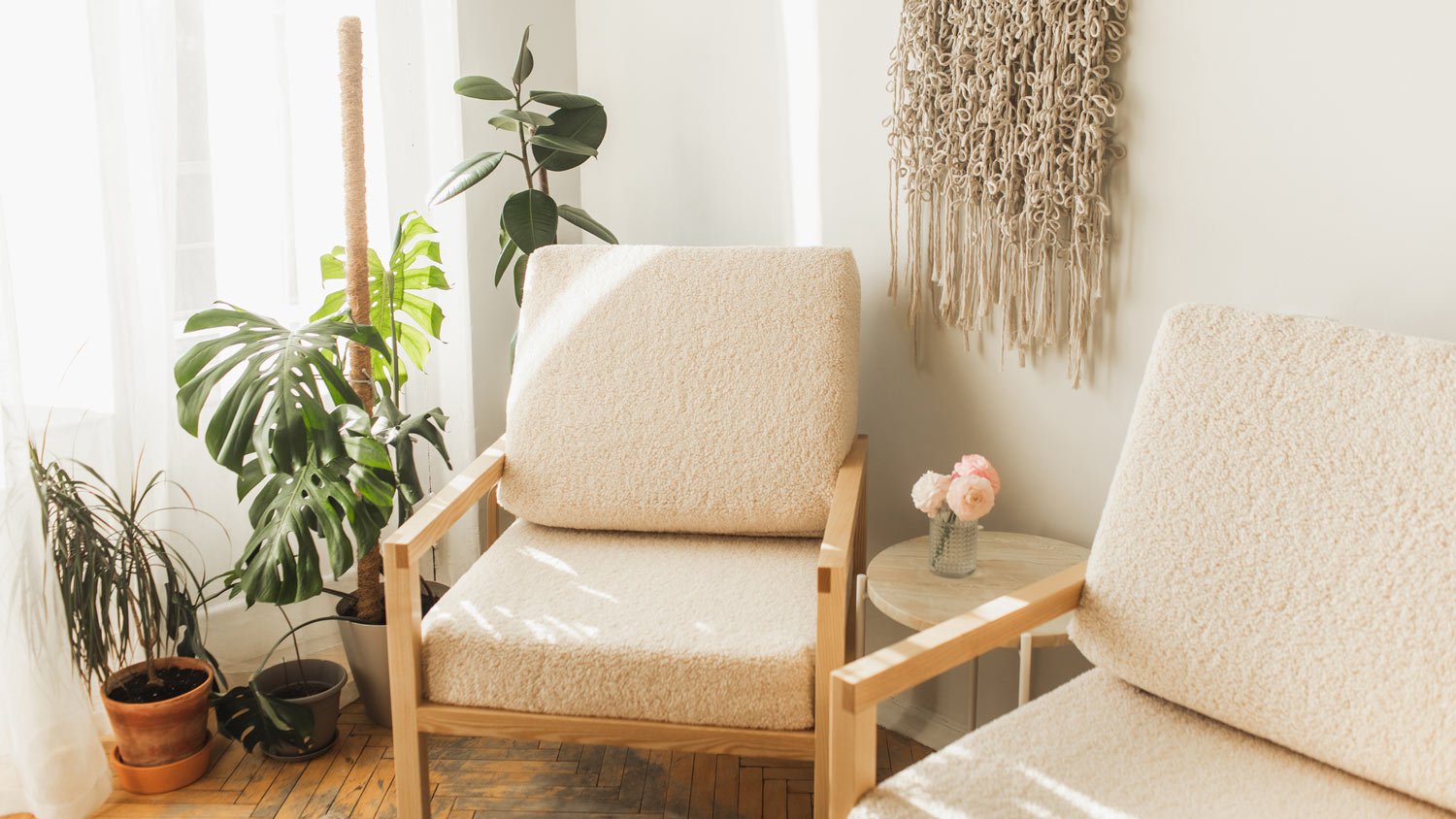 Two upholstered armchairs with fluffy fabric in a bright room