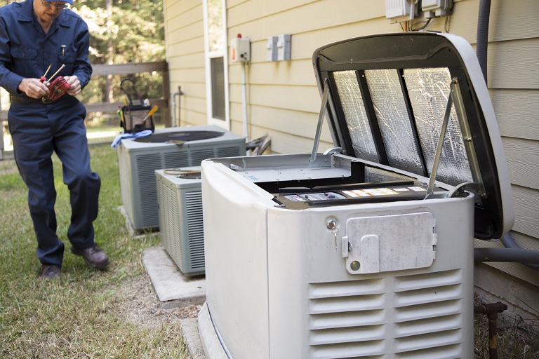 Technician working on generator